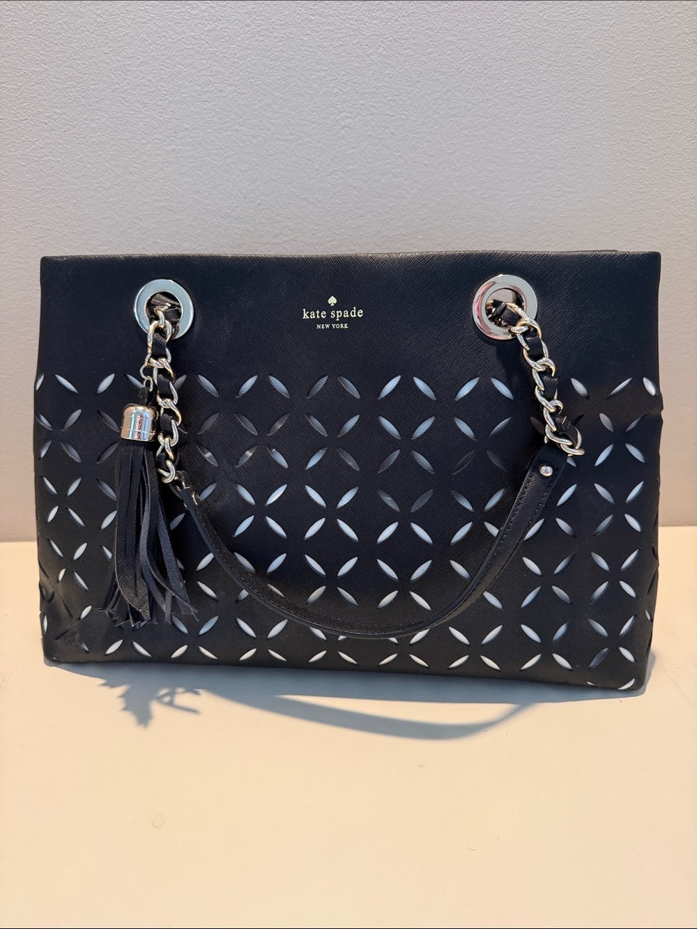 kate spade Black Laser-Cut Tote with Chain Strap and Tassel